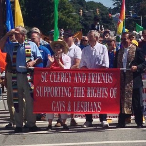 Kenneth Prill, at right holding the banner, has continued his witness for equality in retirement, in South Carolina.